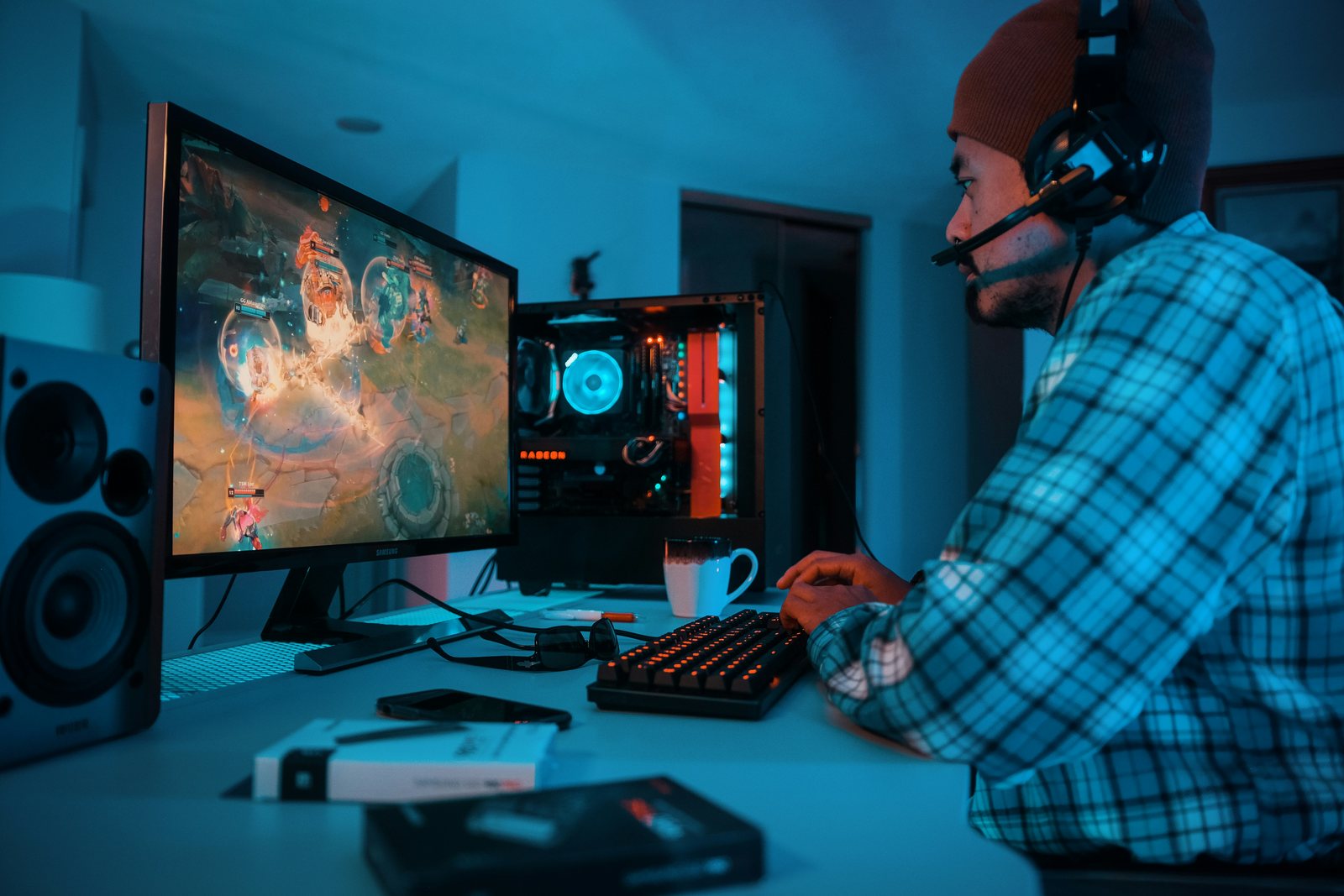a man sitting in front of a computer monitor